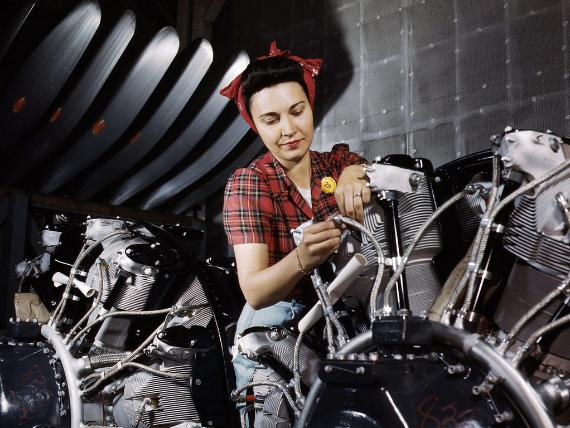 Woman working on motor